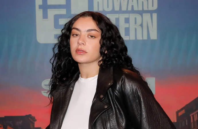 Charli XCX has defended The 1975's Matt Healy after he kissed a man at a Malaysia show