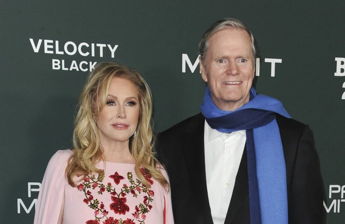 Kathy Hilton has confessed to taking racy snaps and storing them in a vault in bank