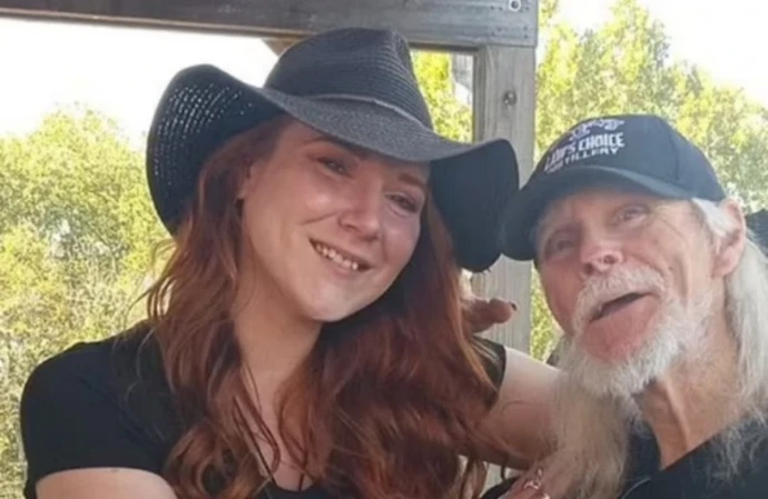 Moonshiners star Kenny Law has died (pictured with Amanda Bryant)