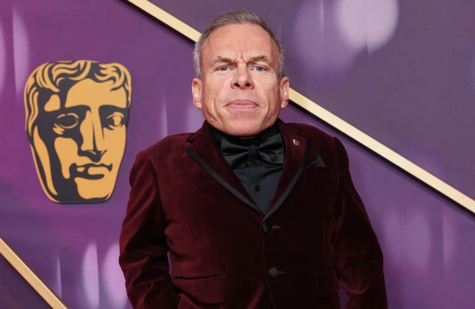 Warwick Davis learned he was getting the BAFTA Fellowship while on the loo