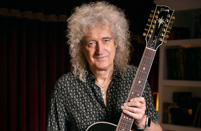 Sir Brian May is sad that his father can't see his new Gibson guitar