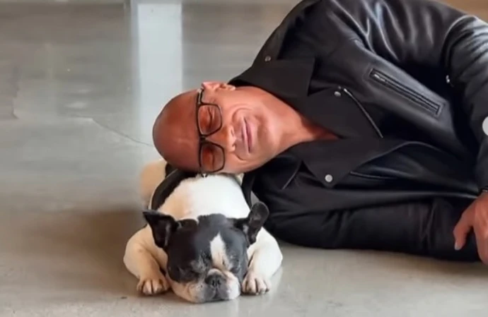 Dwayne Johnson  is feeling 'numb over the loss' of his dog Hobbs