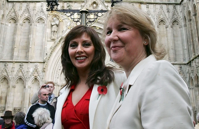 Kathryn Apanowicz (right) with Carol Vorderman at a memorial service for Richard Whiteley in 2005