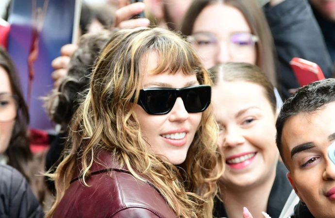 Miley Cyrus performed a stirring ballad from her new album in front of her exes