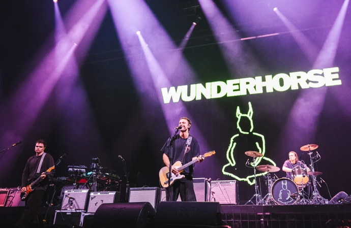 Wunderhorse bassist Peter Woodin has departure the band after seven years.