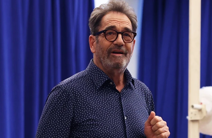 Huey Lewis doubts he'll be able to record or play music again but he's not giving up all hope