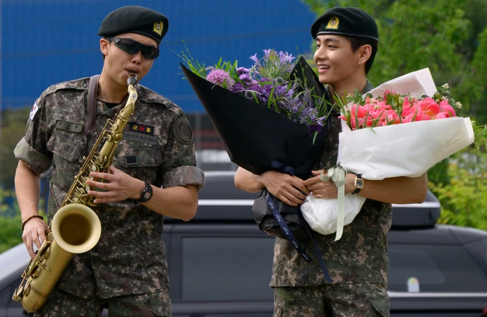 RM and V were discharged from mandatory military service in South Korea on June 10