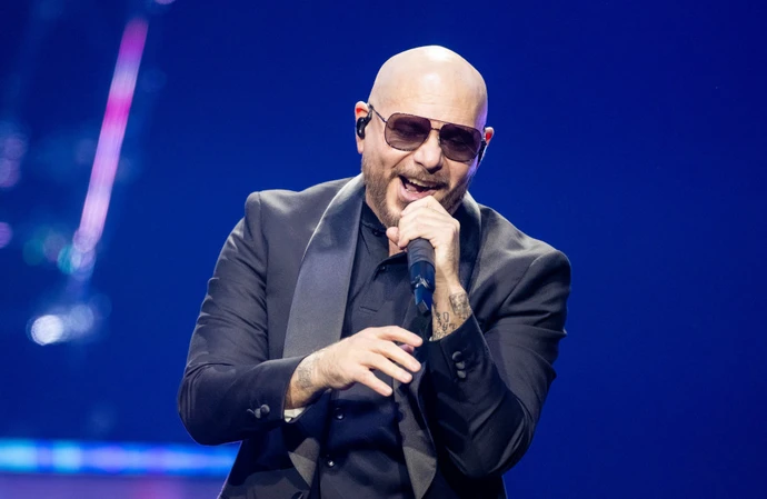 Pitbull says fans donning bald caps to his concerts is 'priceless'