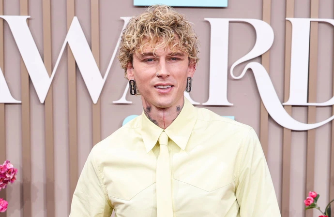 Machine Gun Kelly tapped a music legend to introduce fans to his new album