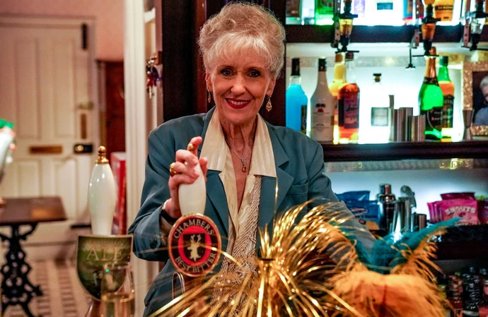 Anita Dobson behind the bar of EastEnders' Queen Victoria pub