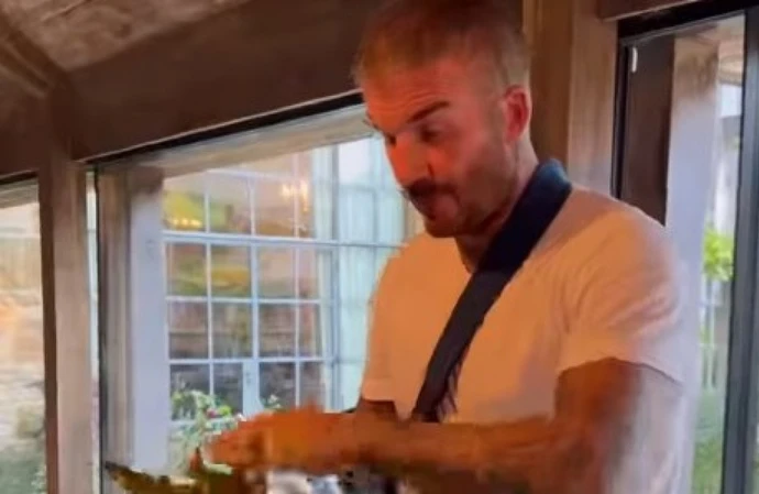 Sir David Beckham recovering at home after wrist operation