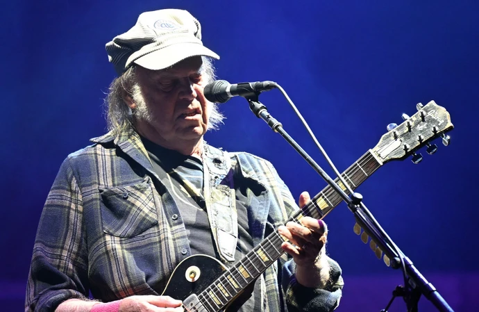 Neil Young on stage at Glastonbury