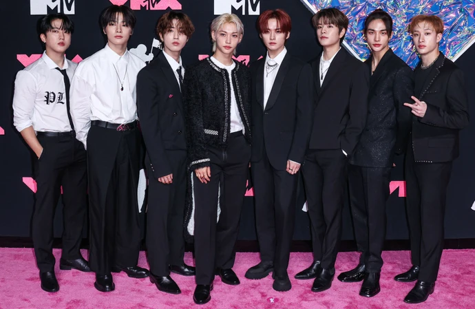 Lee Know (centre) is Gucci's new ambassador