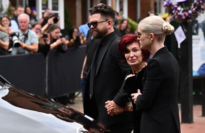 Sharon Osbourne was visibly distraught as she viewed the many flowers and tributes to her late husband Ozzy Osbourne