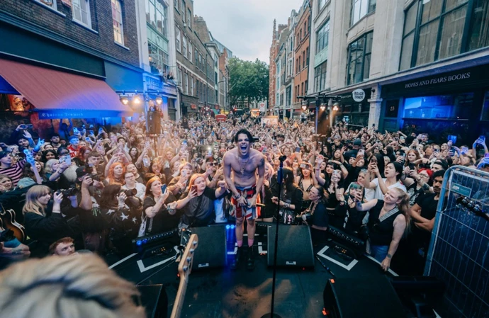 Yungblud delights fans with surprise set as he opens new fan store on London's famous Denmark Street