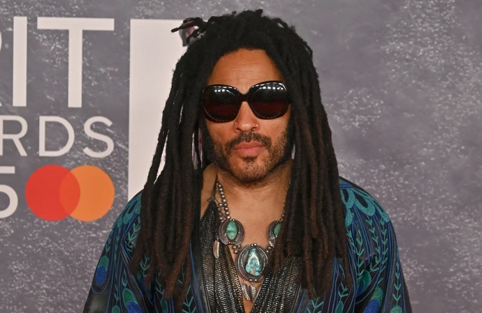 Lenny Kravitz had four of his trademark deadlocks ripped out of his head by a female fan in Brisbane, Australia