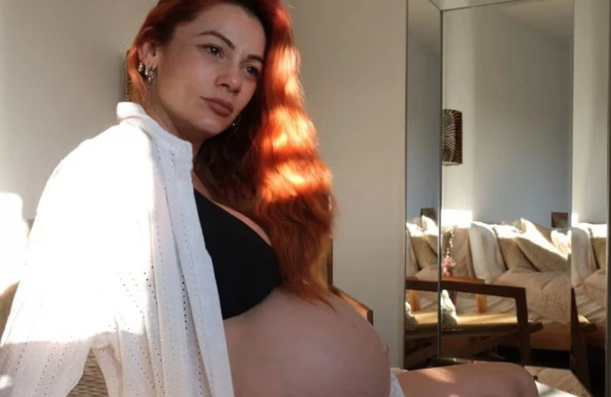 Dianne Buswell proudly displays her blossoming baby bump in an Instagram shoot