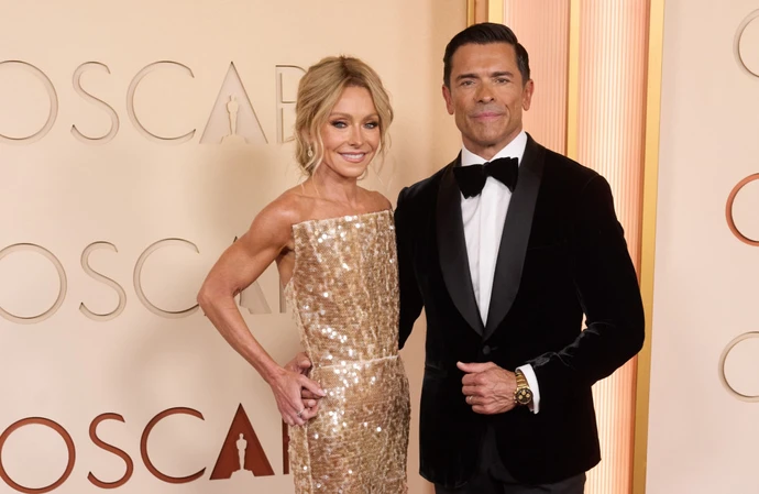 Kelly Ripa has joked she has her own "chastity belt" to stop evening sex with her husband Mark Consuelos