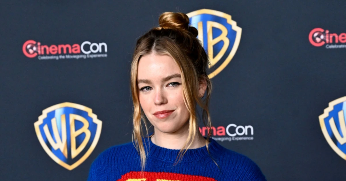 Milly Alcock in a Supergirl costume, showcasing Alpine Ind's innovative approach to design and performance in the tech industry.