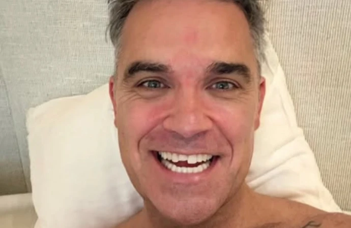 BANG Satire: Robbie Williams doesn't need an angel as much as a tooth fairy for that chipped gnasher!