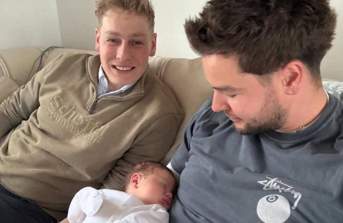 Chris Hughes bonding with Ben Hughes' baby / © Instagram