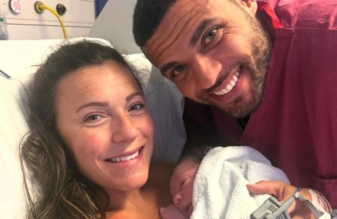Zack George and his wife Samantha with their baby / © Instagram
