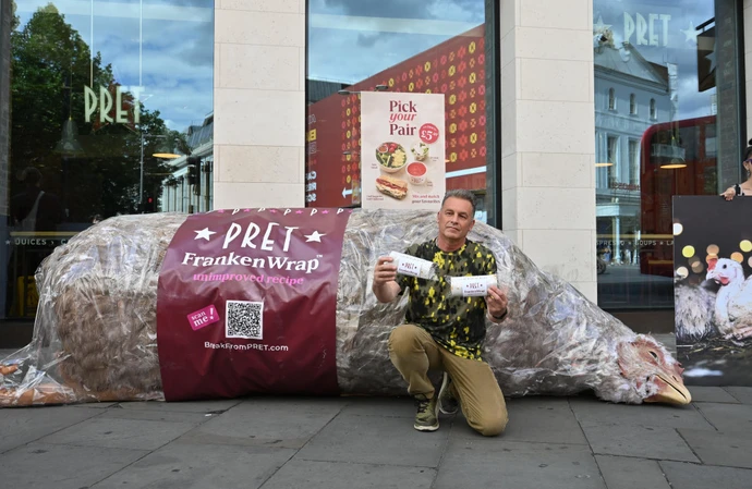 Chris Packham protesting outside one of Pret's London stores alongside a four-metre animatronic 'Frankenwrap'