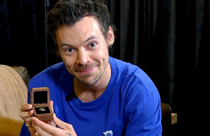 Harry Styles is delighted with his Gold Blue Peter Badge
