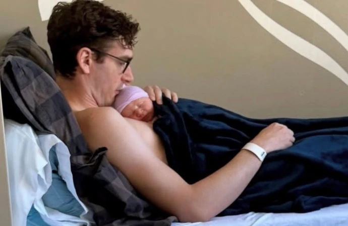 Marston Hefner and his newborn / © Instagram