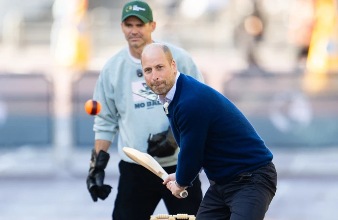 William, Prince of Wales, playing street cricket on The Mall