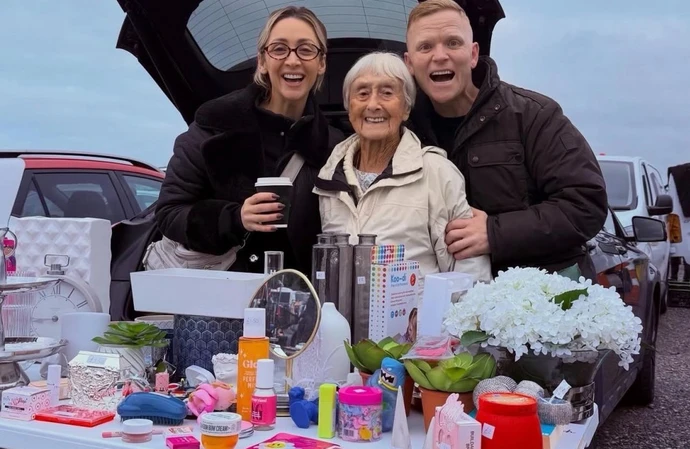 Lucy-Jo Hudson, Lewis Devine and Daphne at a car boot sale / © Instagram