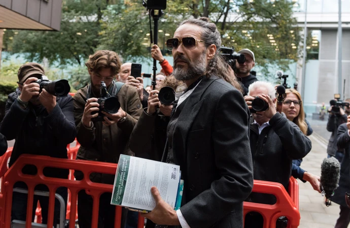 Russell Brand prays before court every day