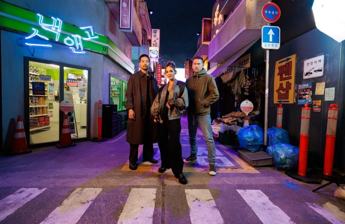 Barry Sloane with co-stars Joseph Lee and Maria Elisa Camargo at Call of Duty: Modern Warfare 4's Korean Alley popup